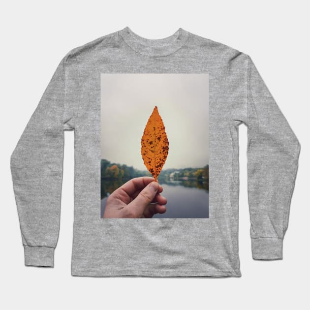 hand holding yellow leaf Long Sleeve T-Shirt by psychoshadow